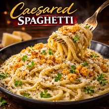 Load image into Gallery viewer, Caesared Spaghetti A bold twist on Caesar salad — creamy, garlicky, peppery pasta perfection.
